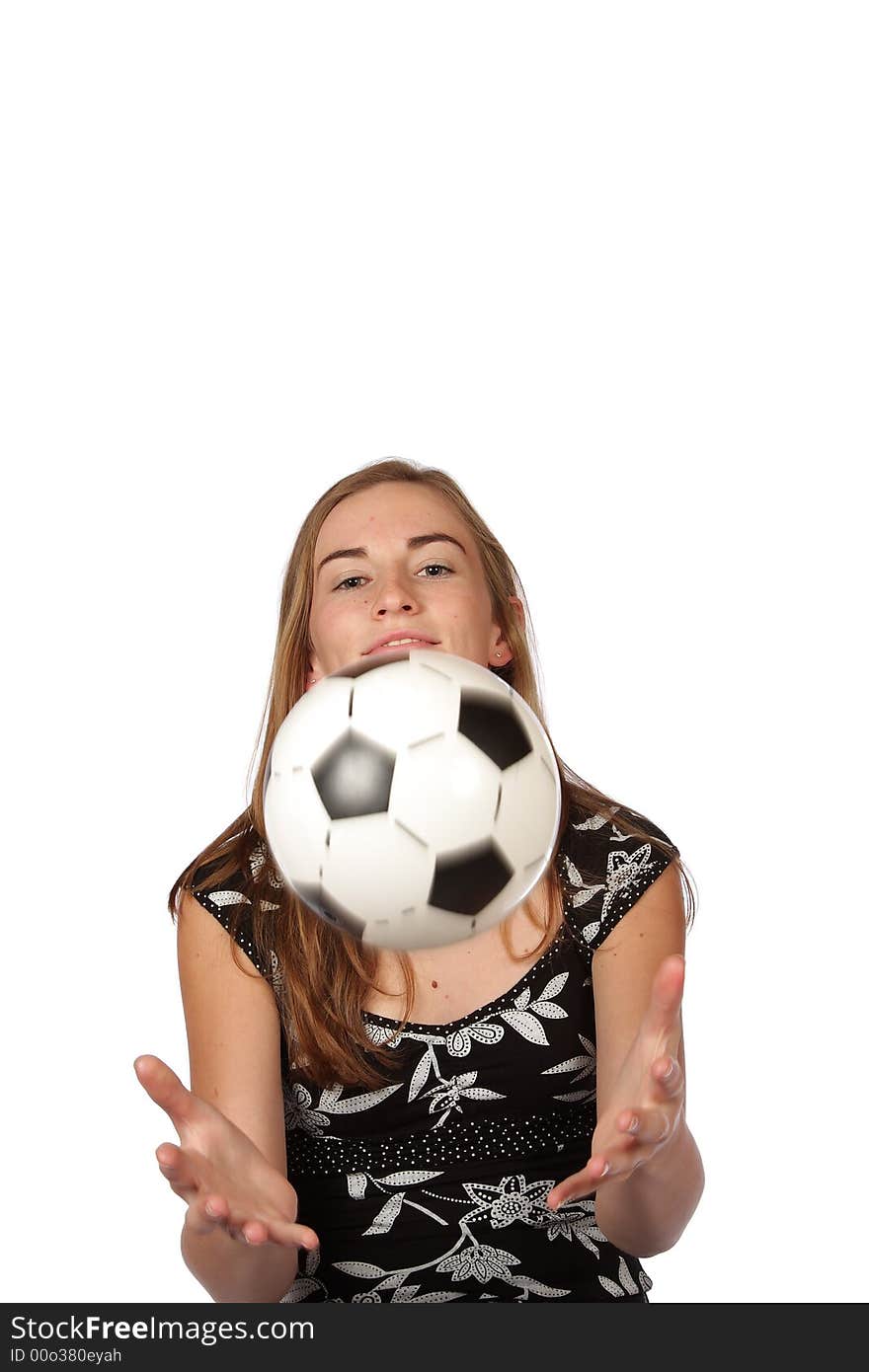 Football thrown in the air by a girl. Football thrown in the air by a girl