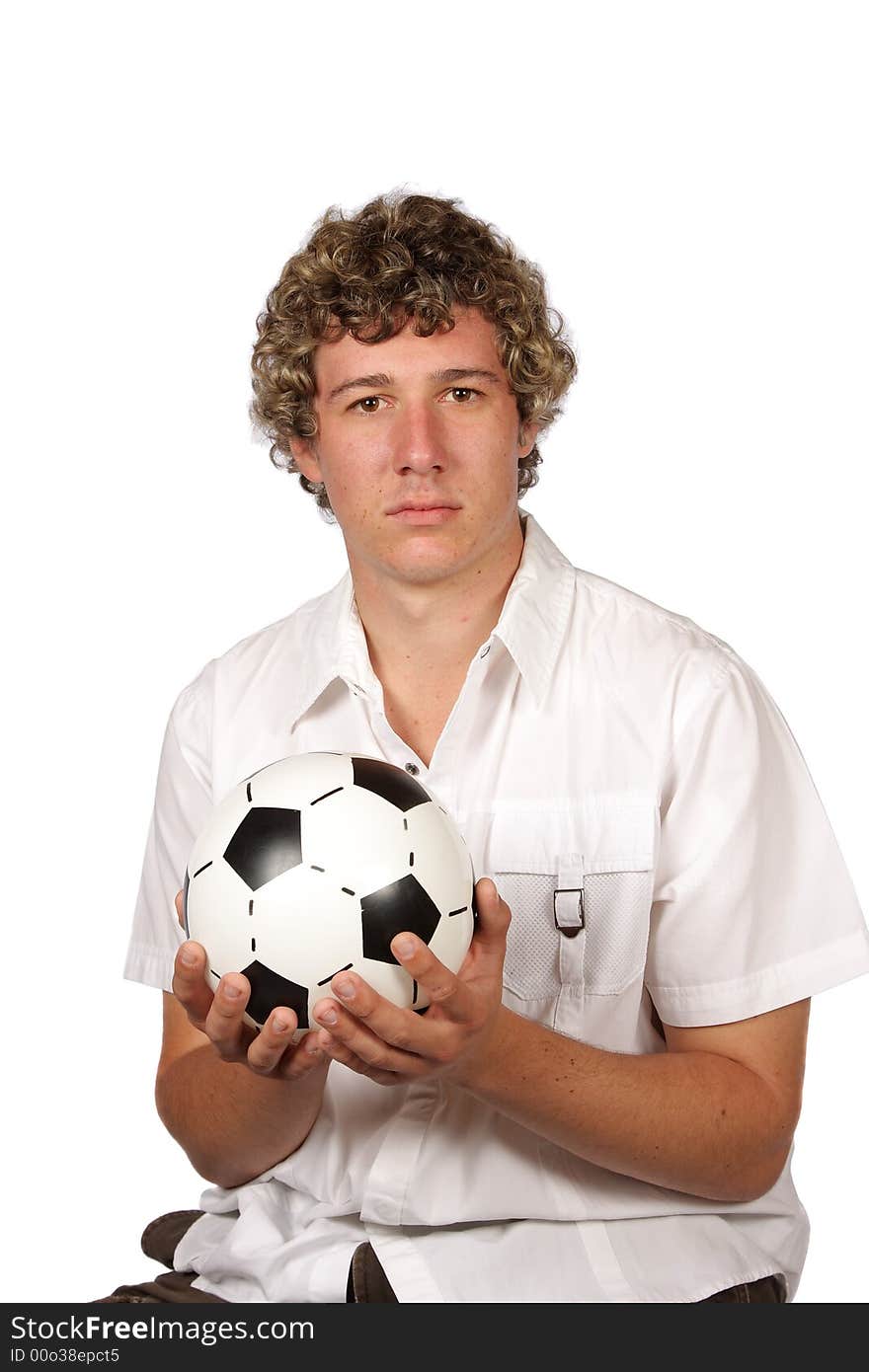 Soccer player holding football in his hands. Soccer player holding football in his hands