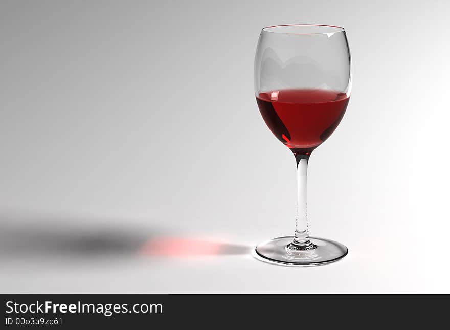 Red wine in the wineglass on  the white background