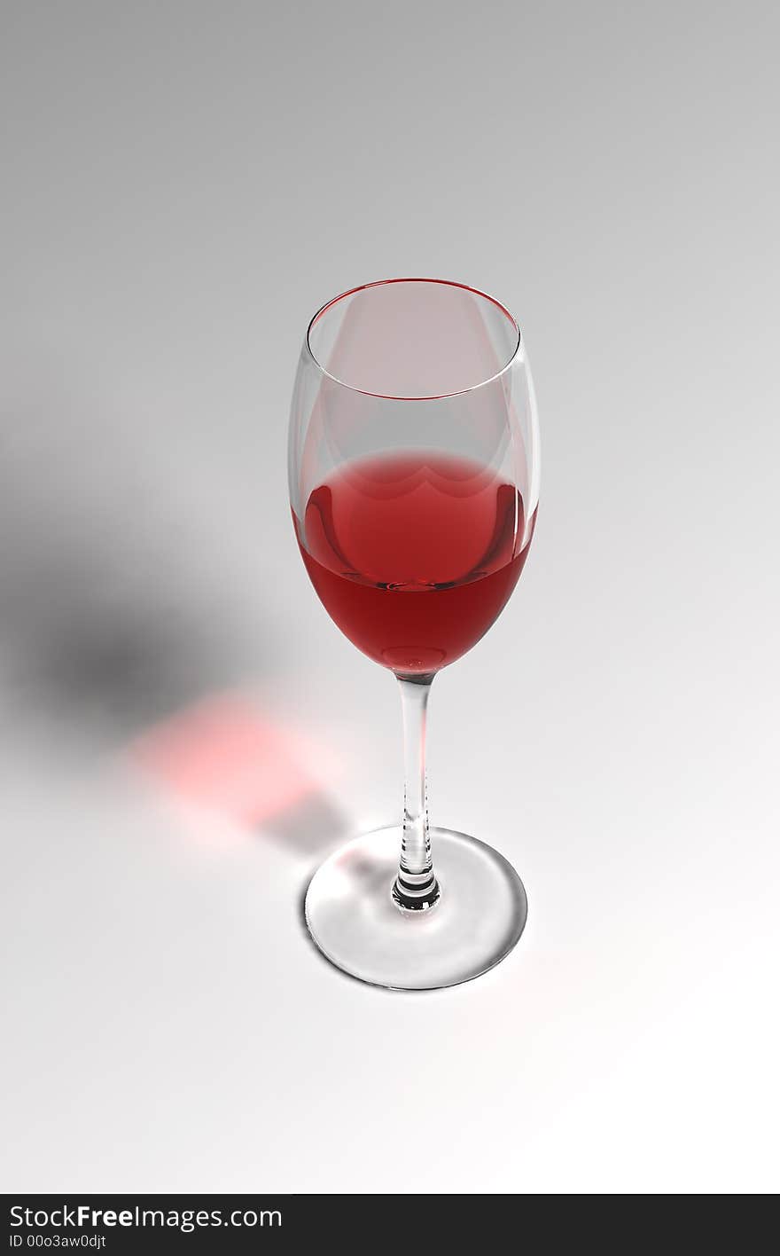 Red wine in the wineglass on  the white background