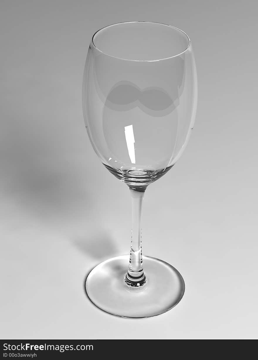 Empty white wineglass on white background