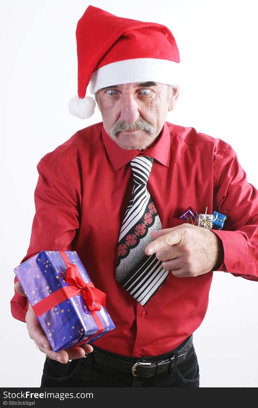 Businessman with Christmas gift and Santa Claus hat. Businessman with Christmas gift and Santa Claus hat.