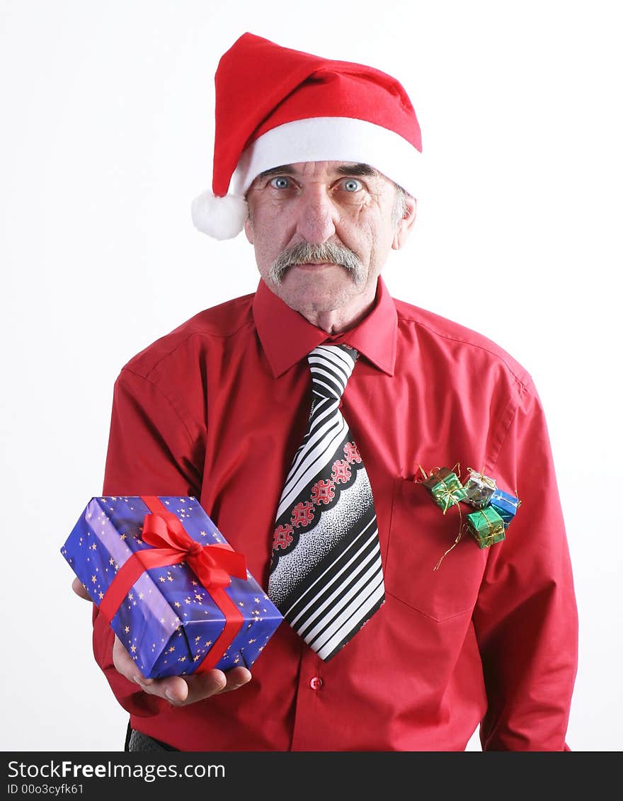 Businessman with Christmas gift and Santa Claus hat. Businessman with Christmas gift and Santa Claus hat.