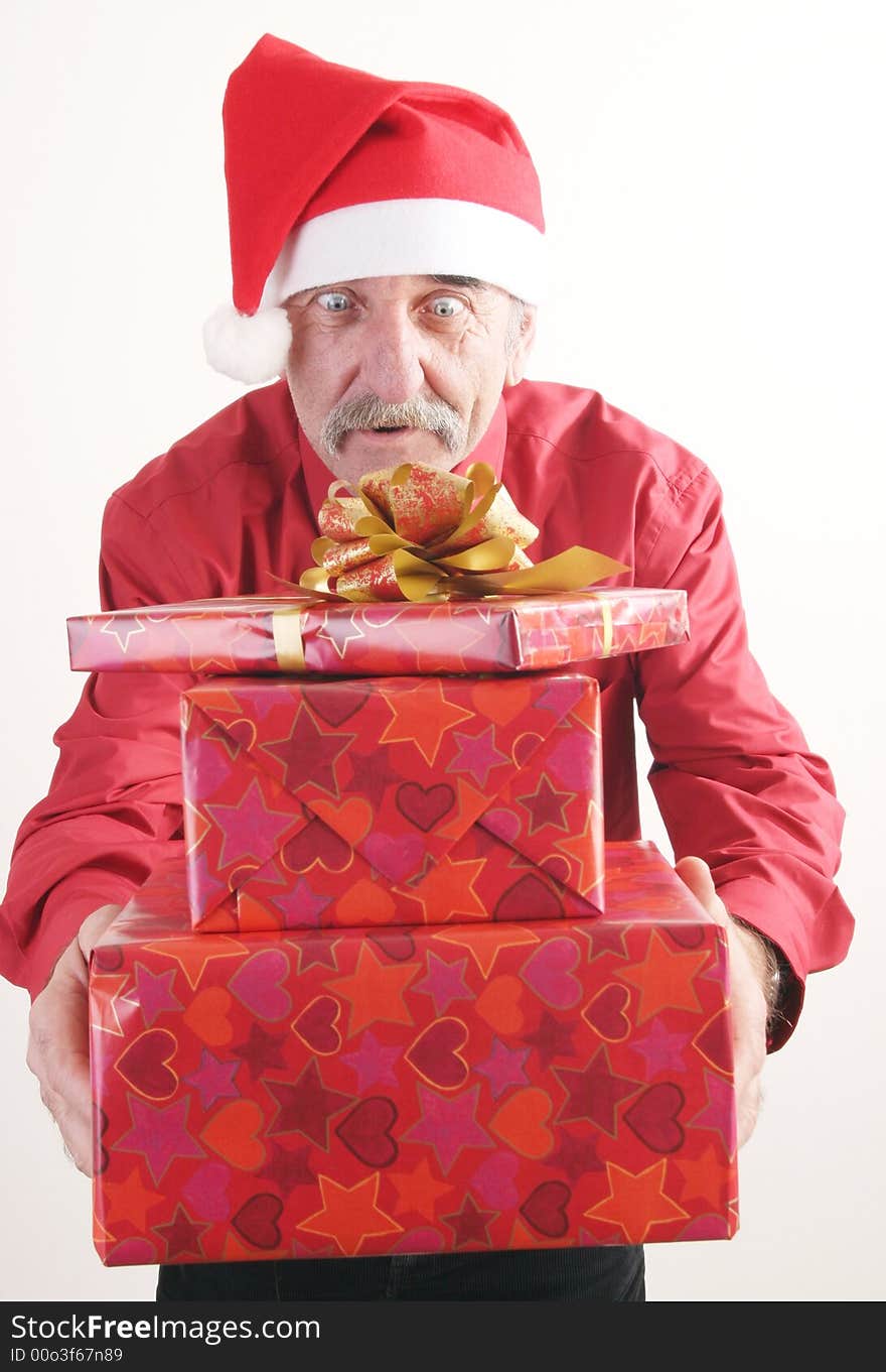 Businessman with Christmas gift and Santa Claus hat. Businessman with Christmas gift and Santa Claus hat.