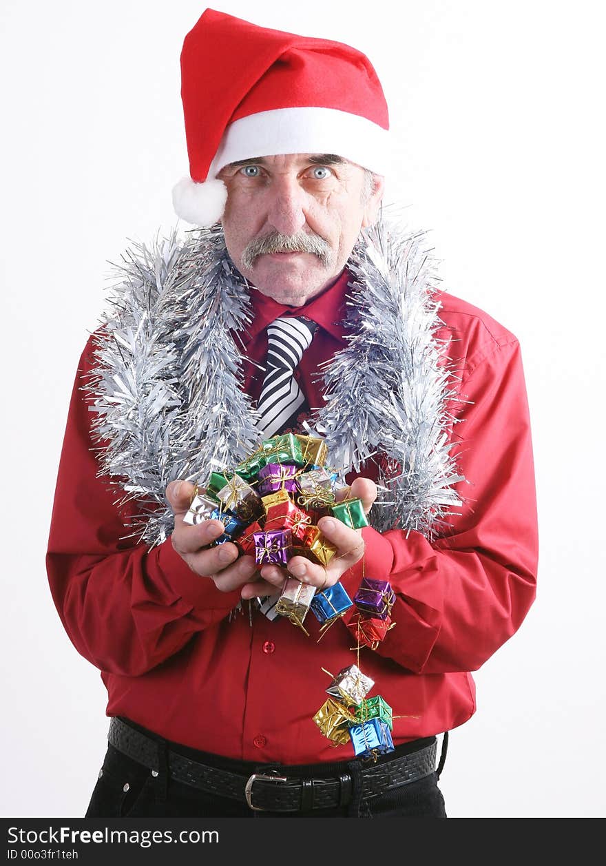 Businessman with Christmas gift and Santa Claus hat. Businessman with Christmas gift and Santa Claus hat.