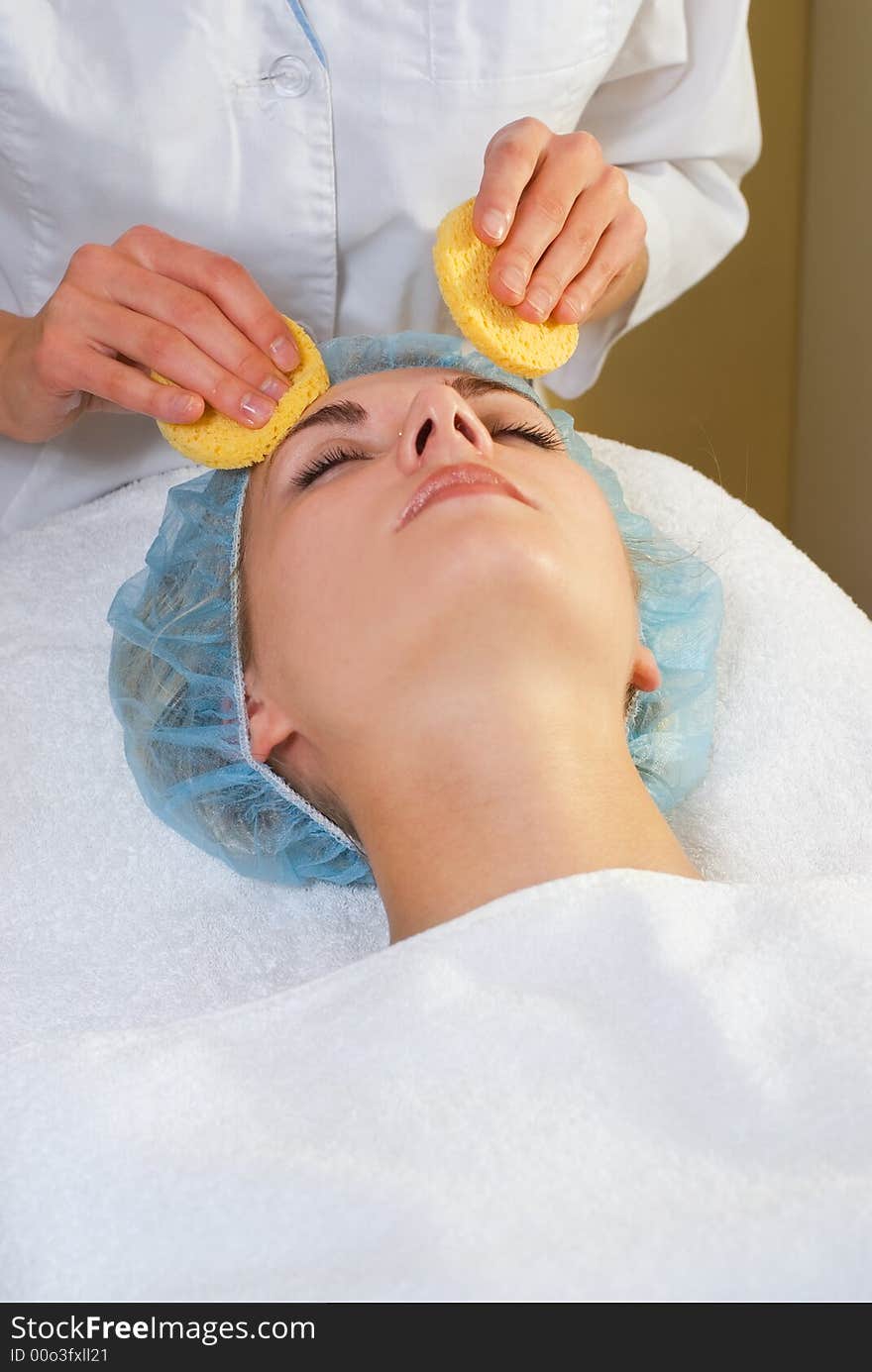 Beautiful girl in spa salon