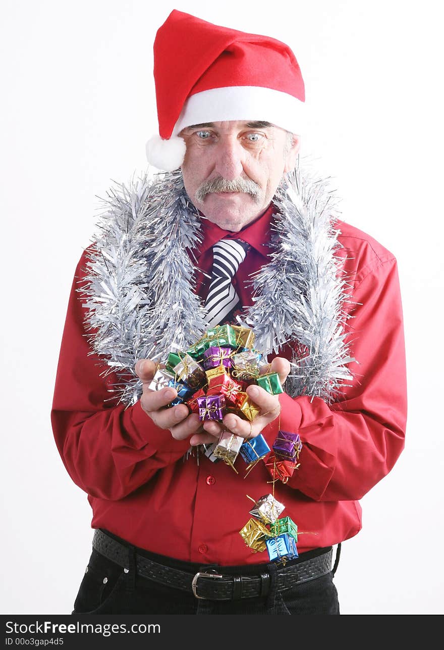 Businessman with Christmas gift and Santa Claus hat. Businessman with Christmas gift and Santa Claus hat.