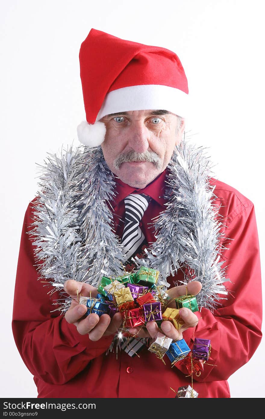 Businessman with Christmas gift and Santa Claus hat. Businessman with Christmas gift and Santa Claus hat.