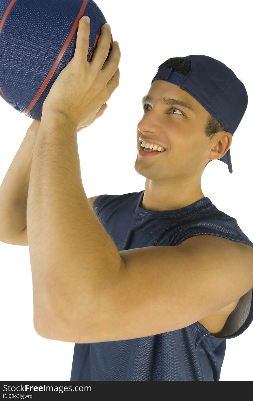 Young, happy man preparing to throw basketball. White background.