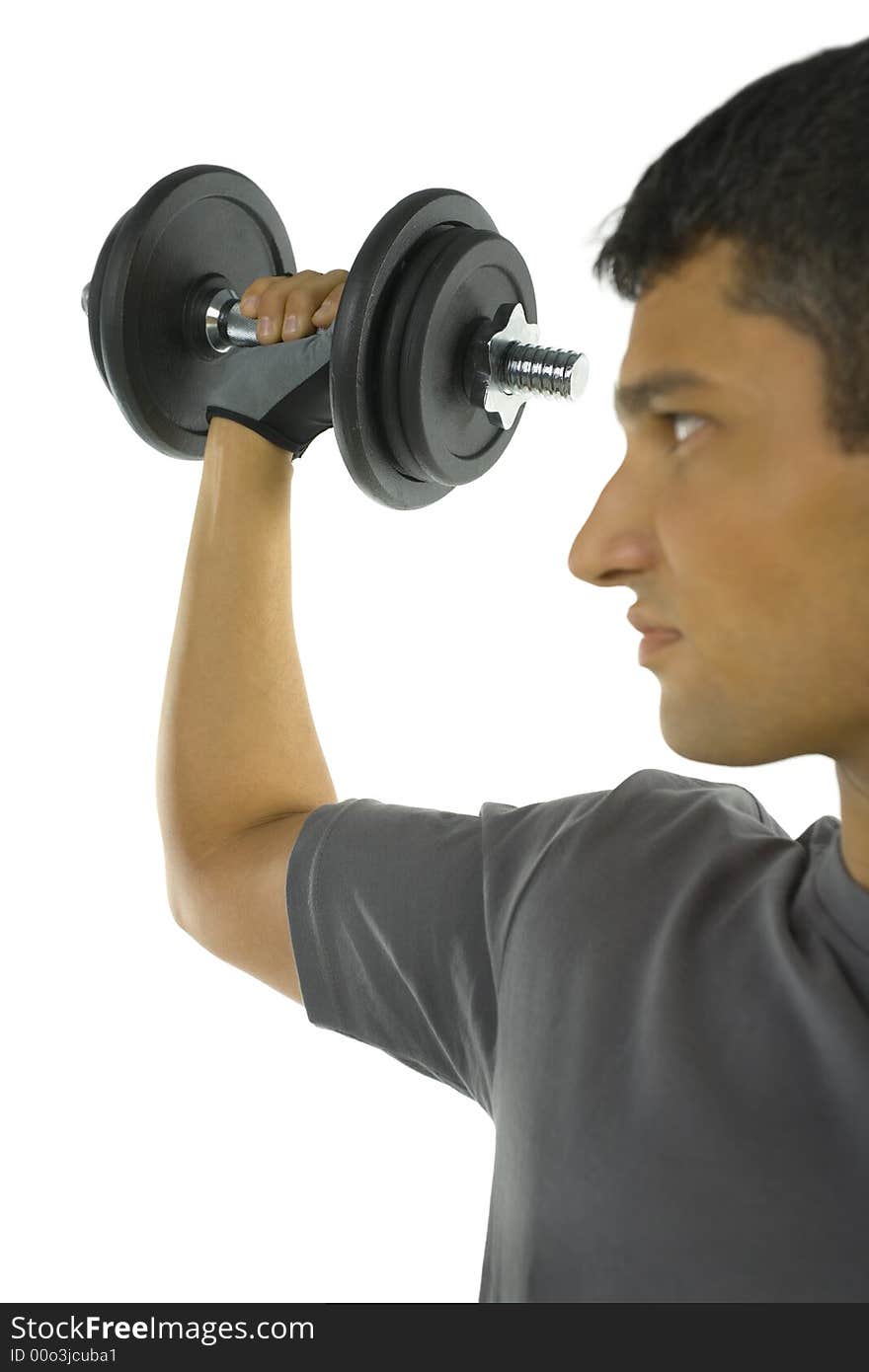 Young man exercising arm muscles with dumbbell. White background. Young man exercising arm muscles with dumbbell. White background.