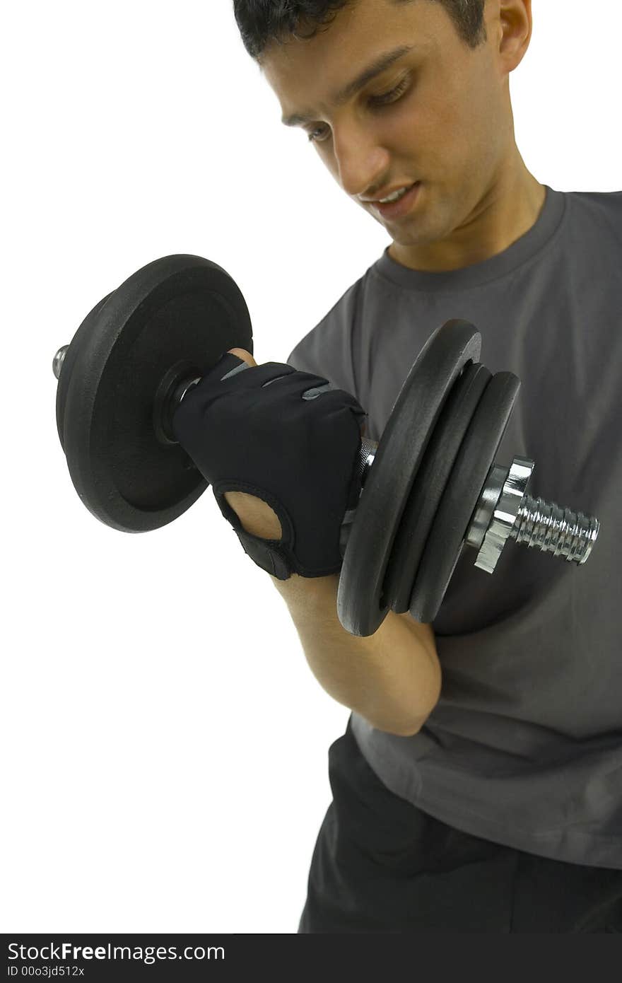 Young man exercising arms muscles with dumbbell. White background, front view. Young man exercising arms muscles with dumbbell. White background, front view.