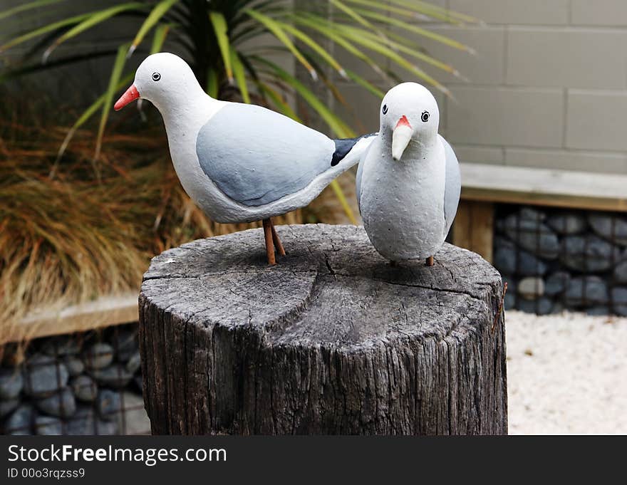 Bird statues on a wooden block. Bird statues on a wooden block.