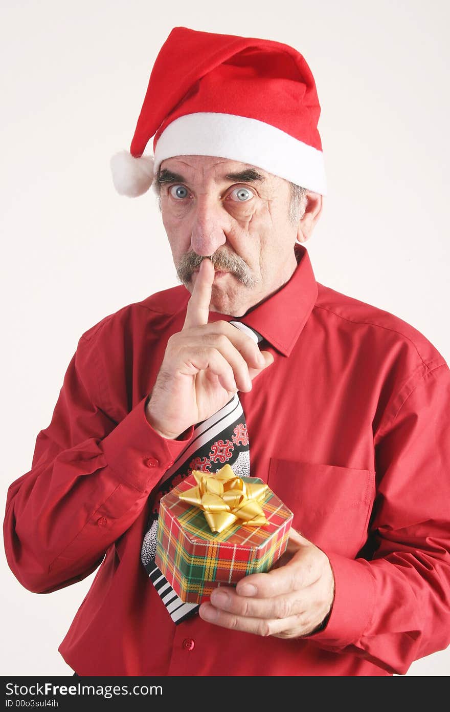 Businessman with Christmas gift and Santa Claus hat. Businessman with Christmas gift and Santa Claus hat.