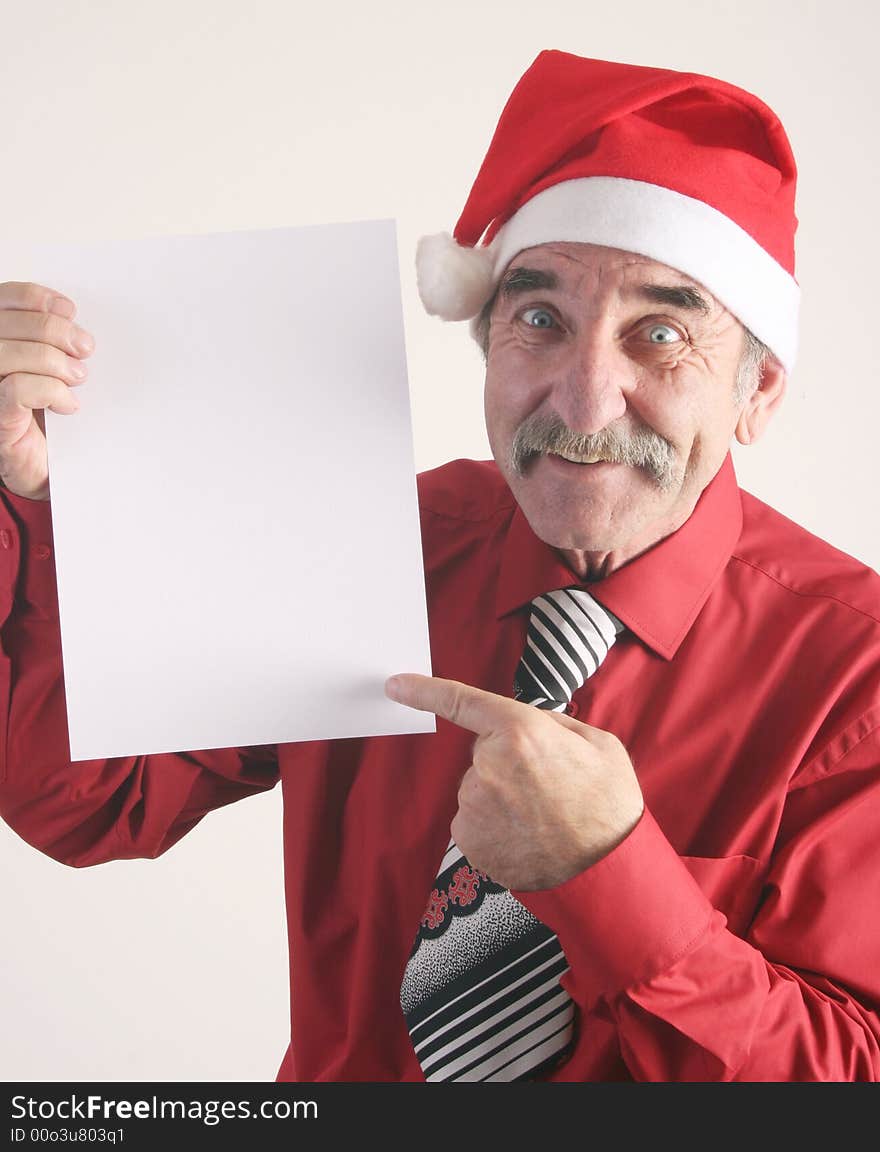 Businessman with blank sign and Santa Claus hat. Businessman with blank sign and Santa Claus hat.