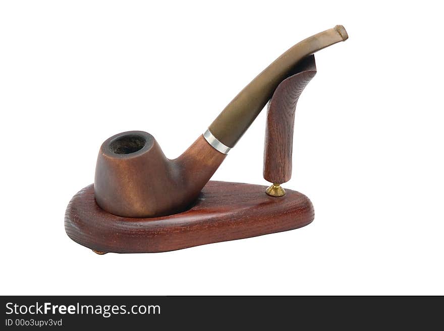 Old brown cherry pipe stay on the support. Old brown cherry pipe stay on the support