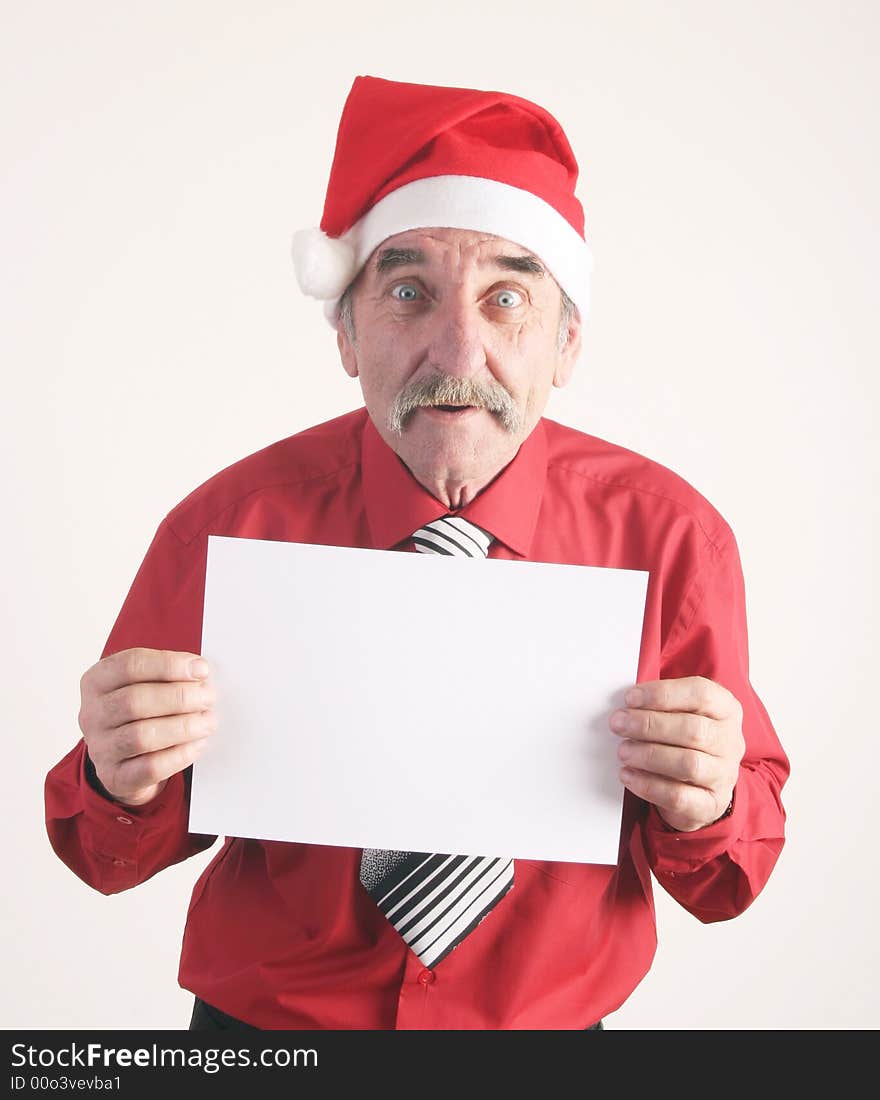 Businessman with blank sign and Santa Claus hat. Businessman with blank sign and Santa Claus hat.