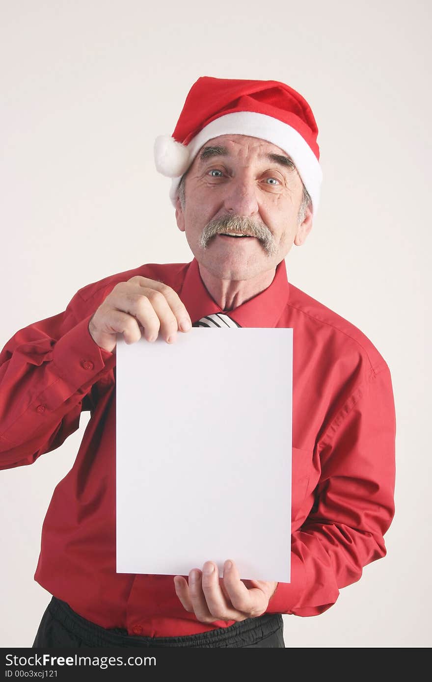 Businessman with blank sign and Santa Claus hat. Businessman with blank sign and Santa Claus hat.