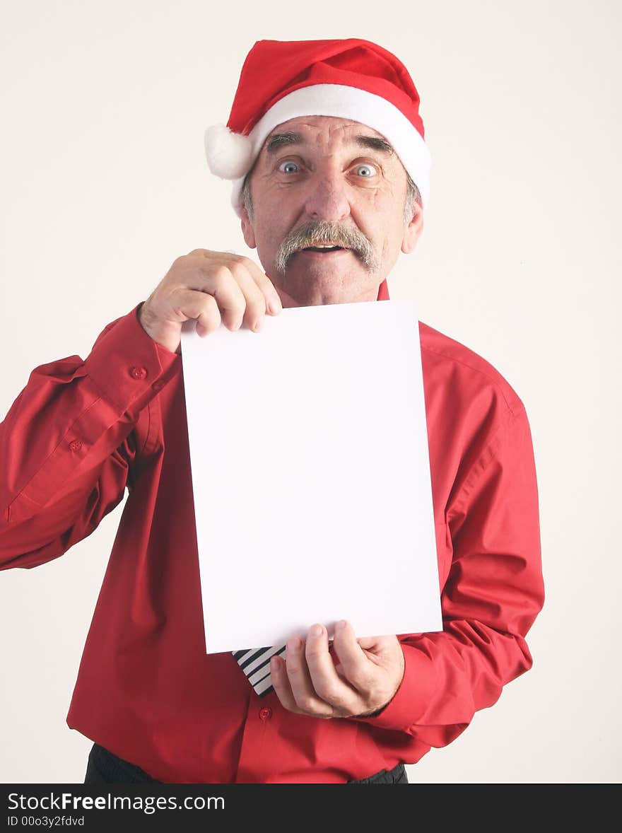 Businessman with blank sign and Santa Claus hat. Businessman with blank sign and Santa Claus hat.