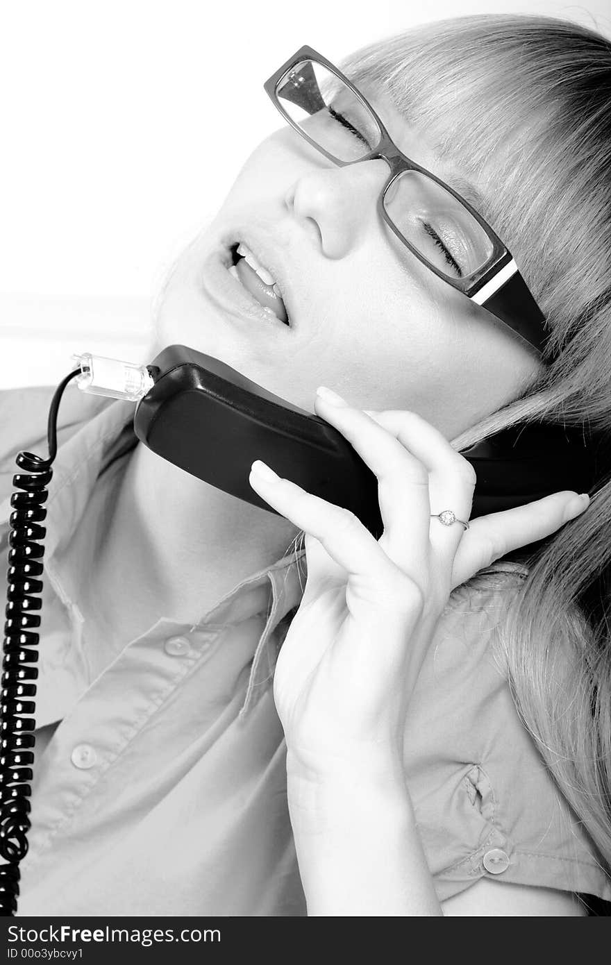 Attractive woman having conversation over the phone. Attractive woman having conversation over the phone