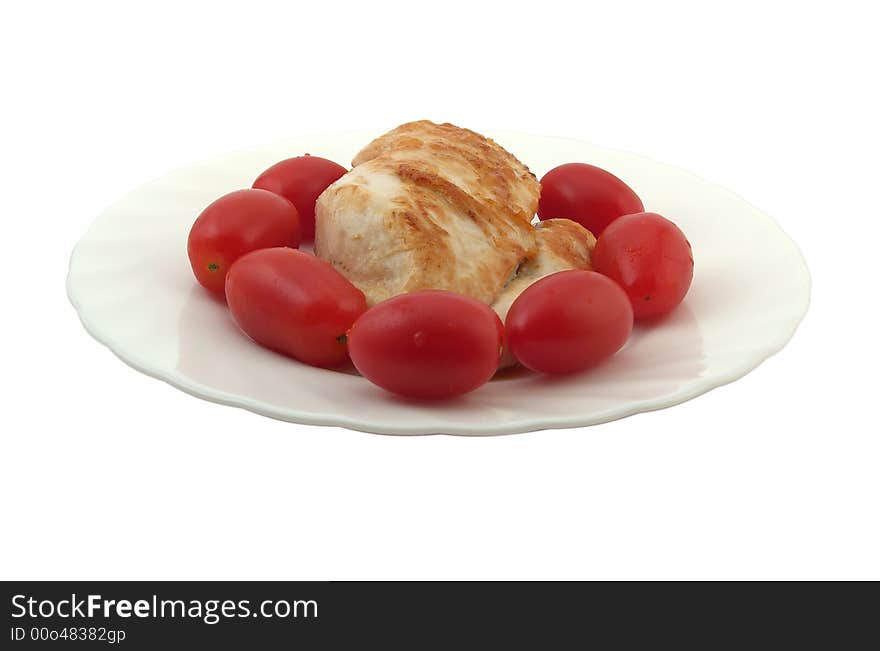 Fried chicken meat with tomatoes, on white background.