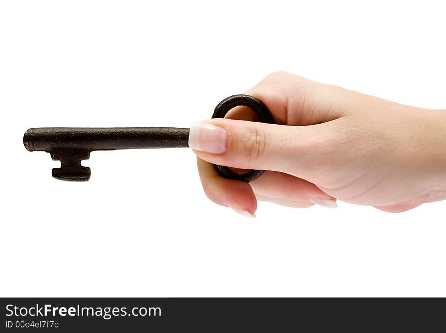 Female hand holding an old and rusty key. Isolated on a white background. Female hand holding an old and rusty key. Isolated on a white background.