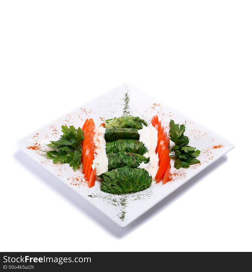 Gourmet vegetarian dish on white background. Gourmet vegetarian dish on white background