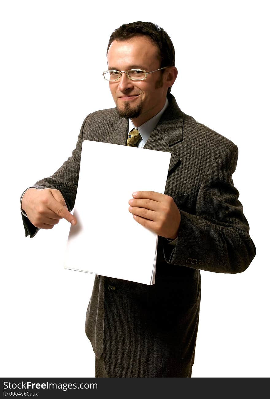 Young handsome businessman pointing to a blank sheet of paper.