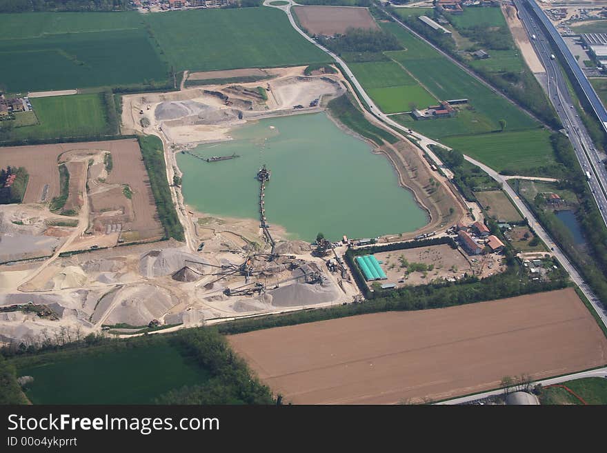 Aerial view of a small artificial lake located between the town Milan and Ticino river. Aerial view of a small artificial lake located between the town Milan and Ticino river