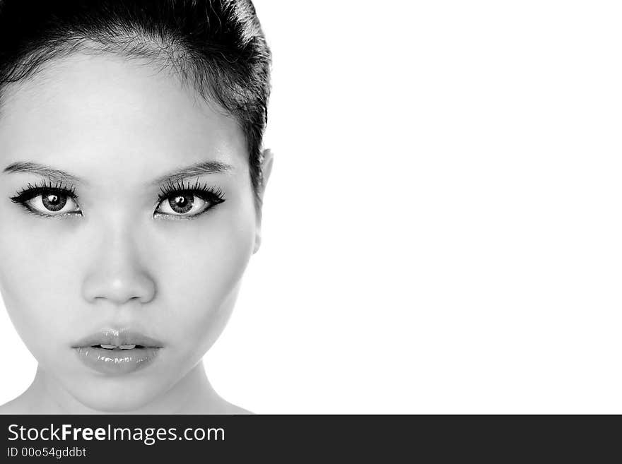 Monochrome image of a young asian girl with a beautiful stare. Monochrome image of a young asian girl with a beautiful stare