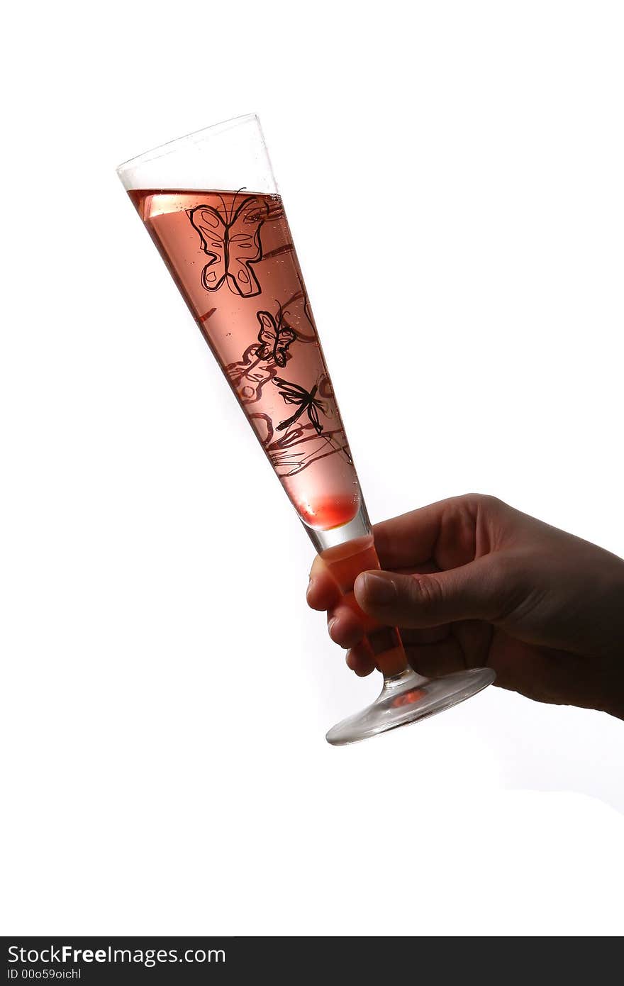 A champagne flute with red champagne with bubbles held by hand. Isolated on white space (for text). A champagne flute with red champagne with bubbles held by hand. Isolated on white space (for text).