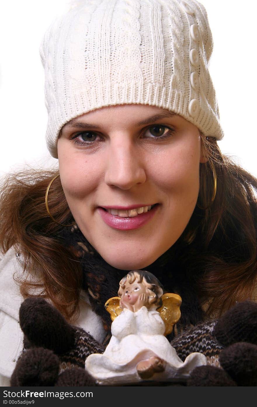 A young woman with a little angel in her hands. Isolated over white space (for text). A young woman with a little angel in her hands. Isolated over white space (for text).