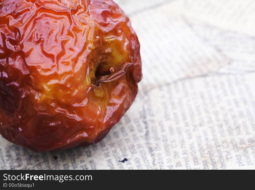 Close up shot of a wrinkled red apple. Close up shot of a wrinkled red apple