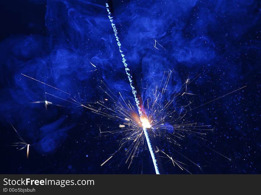 Image of burning sparkler with black background