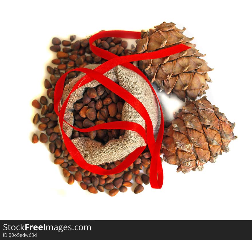 New Year still life with nuts, cones and red ribbon. New Year still life with nuts, cones and red ribbon