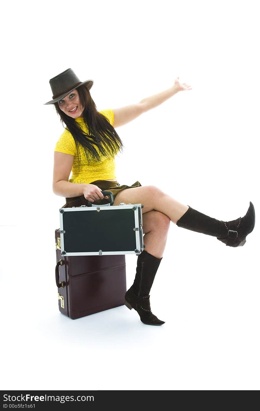 Beautiful brunette with valise on isolated background