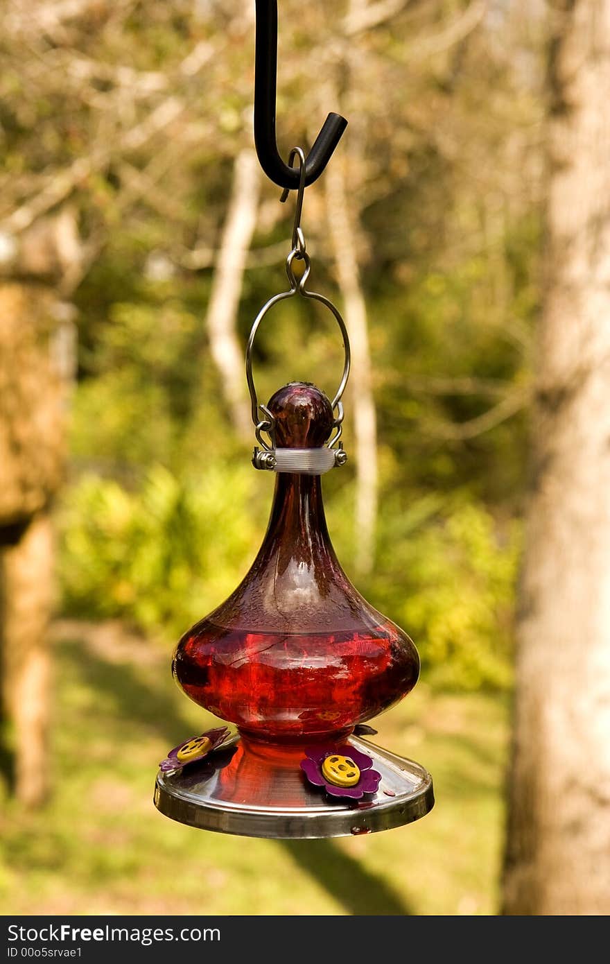 An old fashioned oil lamp hanging on a deck. An old fashioned oil lamp hanging on a deck