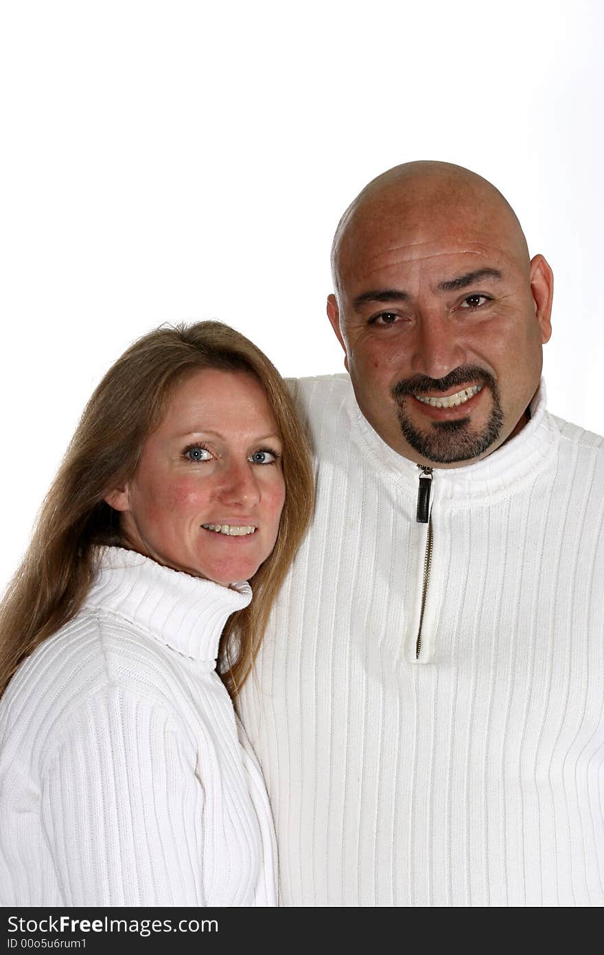 Attractive couple in white sweaters