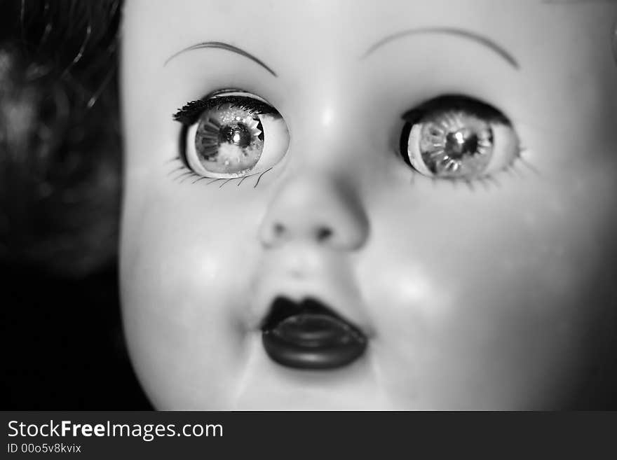 Close up of an old doll in black and white. Close up of an old doll in black and white