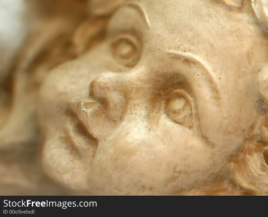 Close up of a an angel carved in stone. Close up of a an angel carved in stone