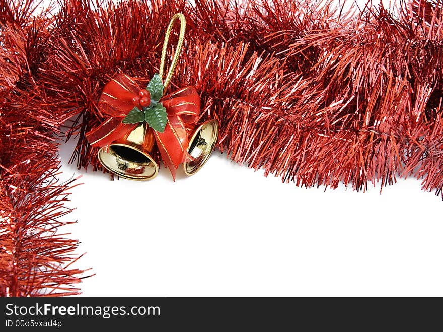 Christmas decoration of two bells in red tinsel isolated on a white background. Christmas decoration of two bells in red tinsel isolated on a white background