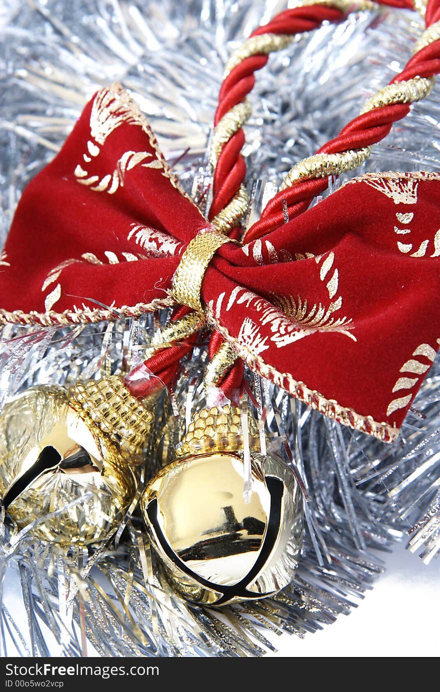 Christmas decoration of two bells in silver tinsel on a white background. Christmas decoration of two bells in silver tinsel on a white background