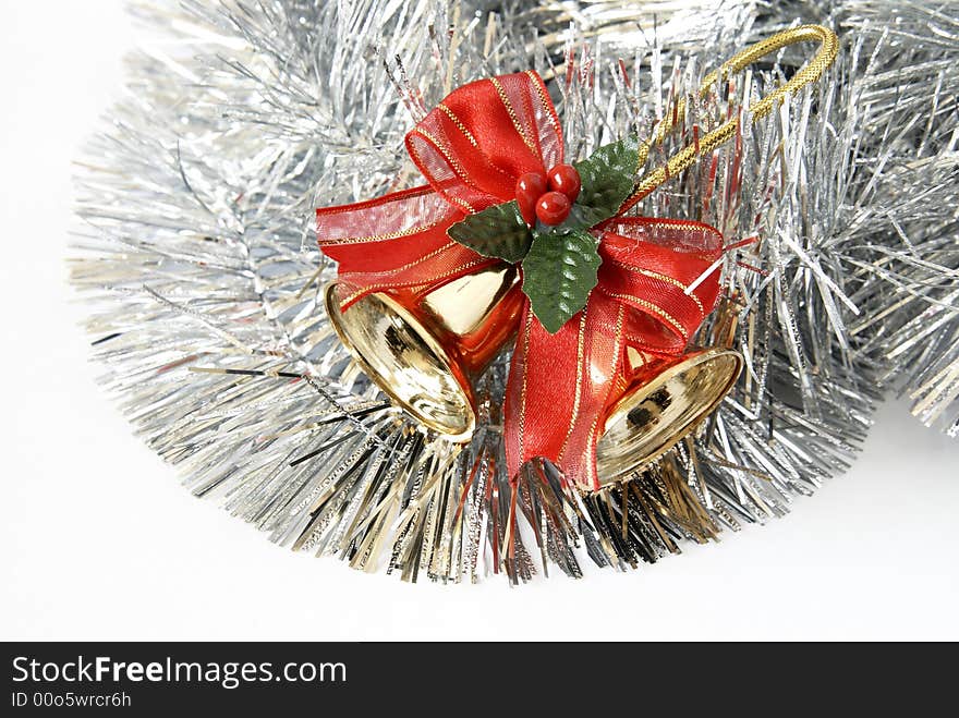 Christmas decoration of two bells in silver tinsel isolated on a white background. Christmas decoration of two bells in silver tinsel isolated on a white background