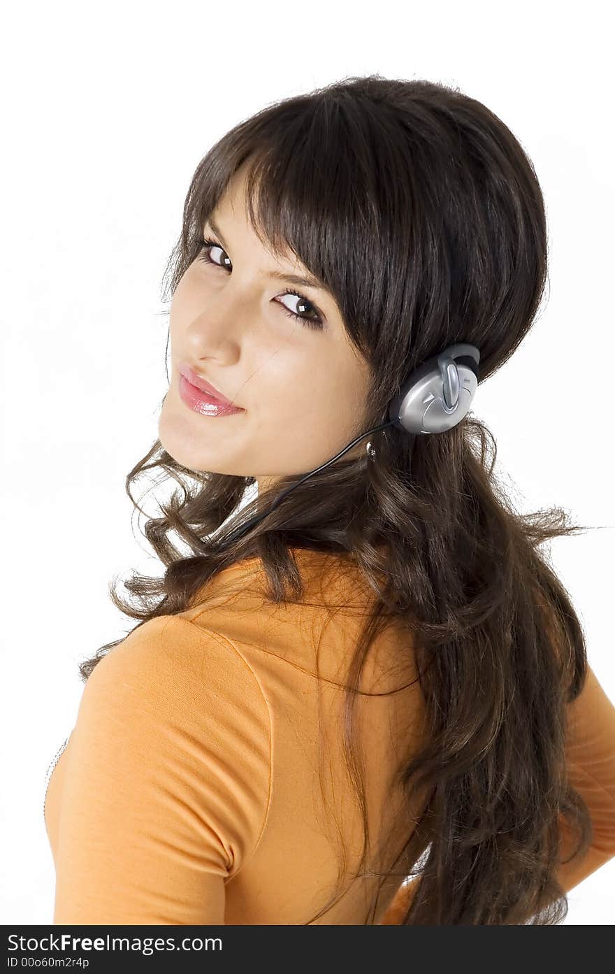 Young brunette girl with headphones listening music. Young brunette girl with headphones listening music.