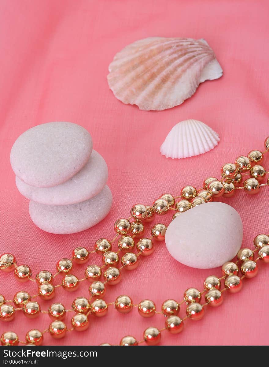 Shells with stones on red background. Shells with stones on red background.