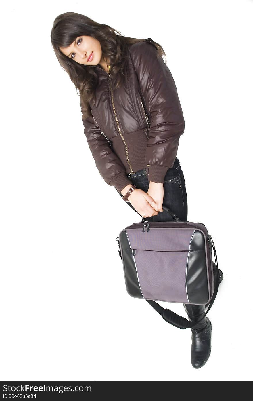 Young brunette teenager girl with laptop bag on white background.