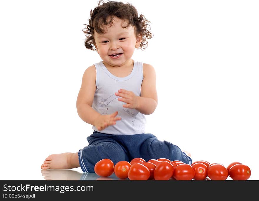 Child with tomato; isolated on a white background. Child with tomato; isolated on a white background.