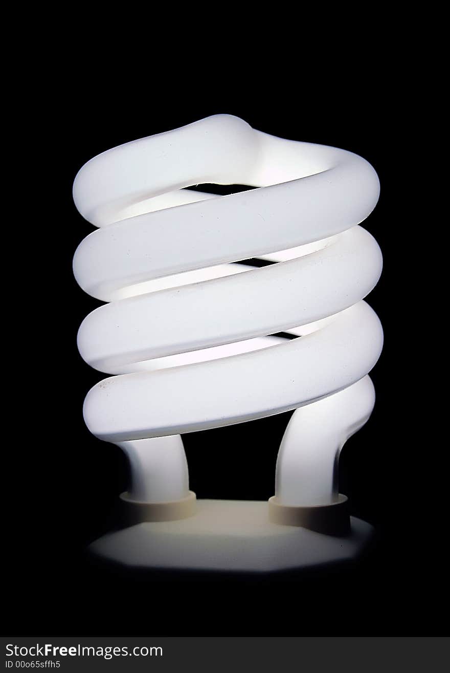 Compact fluorescent light bulb isolated on black background