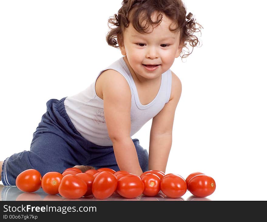 Child with tomato, isolated on a white background. Child with tomato, isolated on a white background.