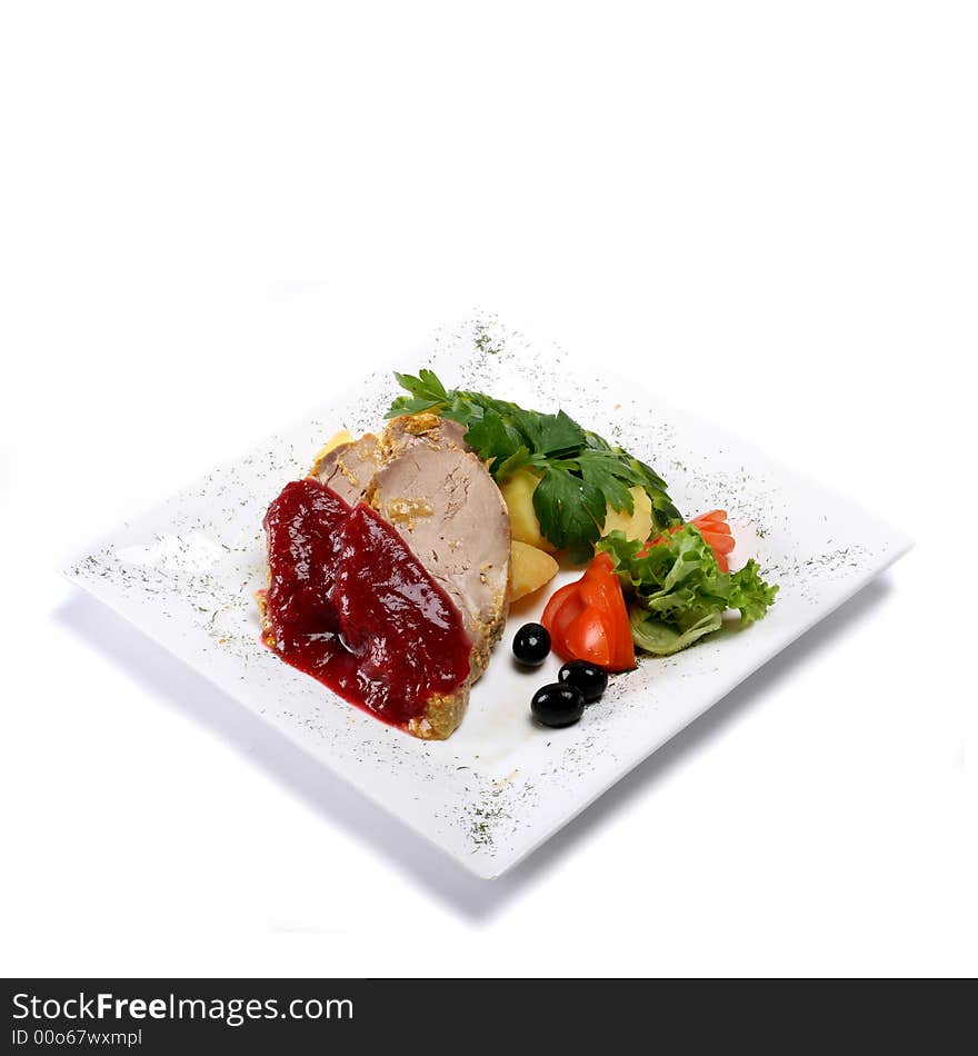 Gourmet pork dish on rectangular plate