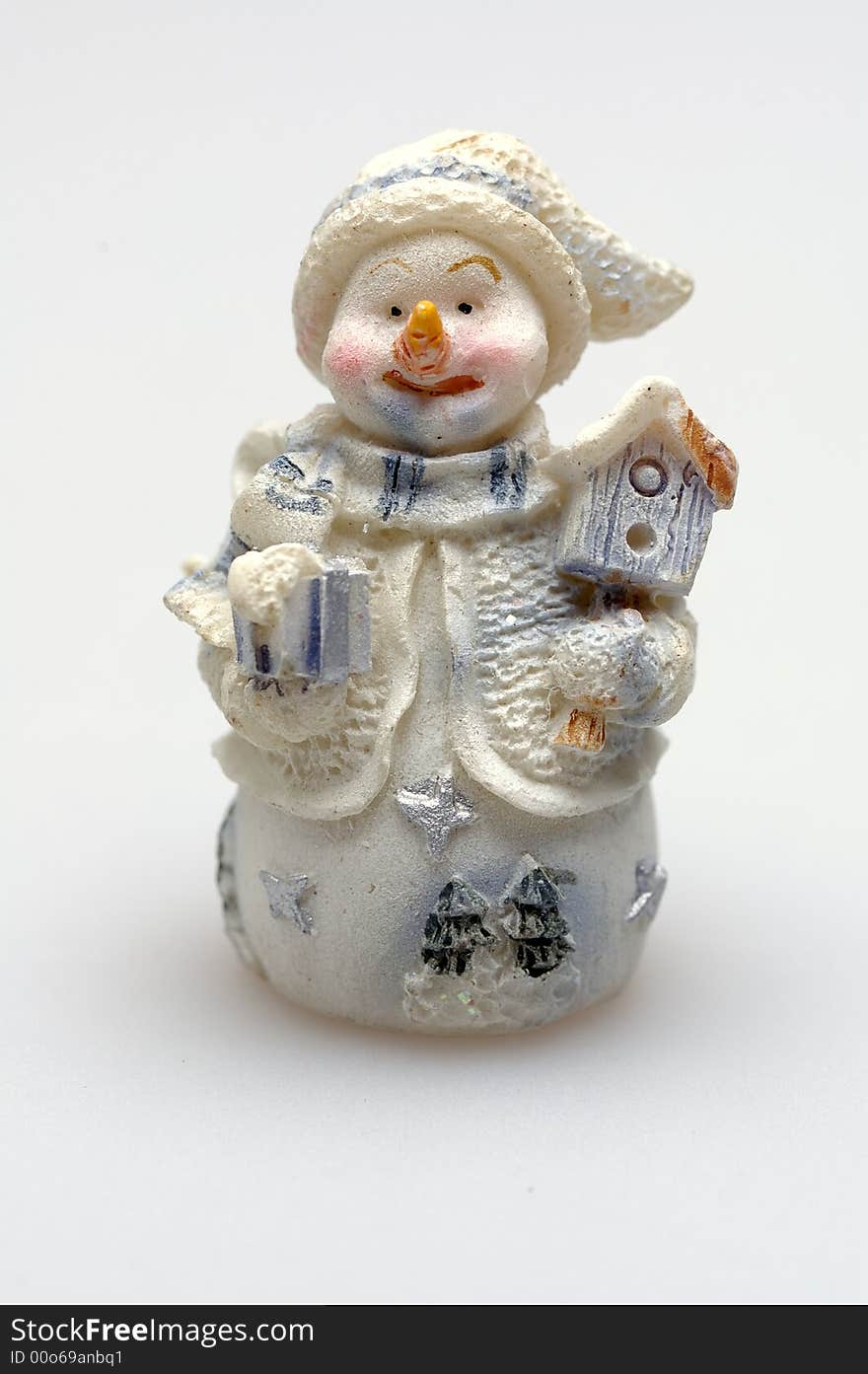 Toy snowman  with birdhouse and gift